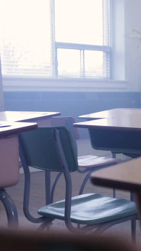 Classroom full of desks in a modern school environment Stock Footage 335983737