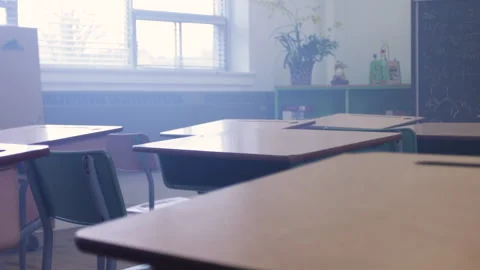 Classroom full of desks in a modern school environment Stock Footage 336135034