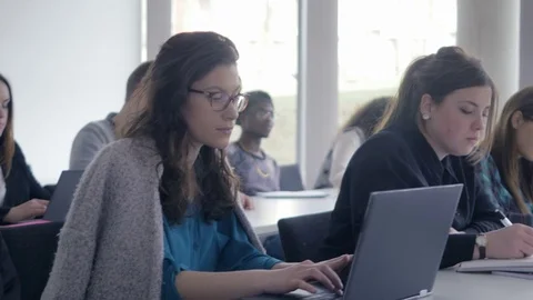 Classroom full of intelligent multi-ethnic students in the lecture Stock Footage 69932129