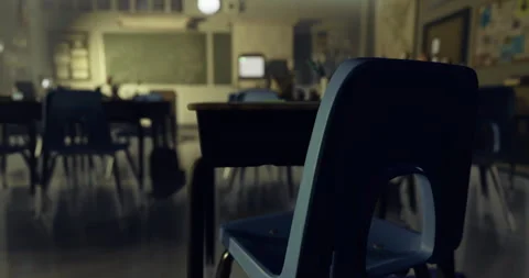 Classroom interior with empty chairs and a desk during quiet study hours Stock Footage 326344246
