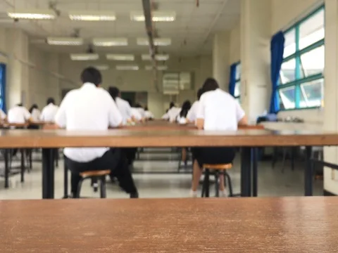 Classroom with people. Students Sitting classroom and doing final exam. Stock Footage 76331610