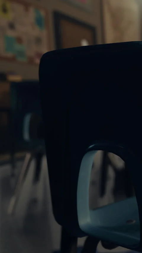 Classroom scene with empty chairs and a doorway in the background Stock Footage 341243382