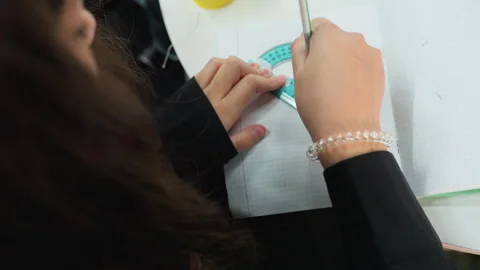 Classroom scene showing focused student with drafting equipment. Topdown Vídeo Stock 334062036