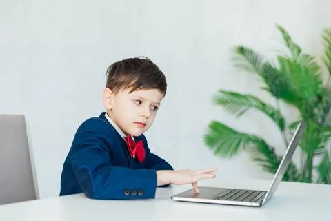 In the classroom at school at the laptop programmer at the computer 写真素材