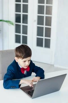 In the classroom at school at the laptop programmer at the computer 写真素材