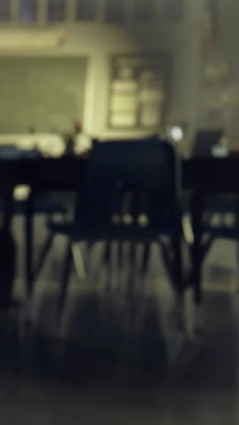 Classroom setting with empty chairs and desks in a learning space Stock Footage 334174674
