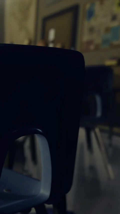 Classroom setting showing a chair in a school with other desks visible Stock Footage 332230607