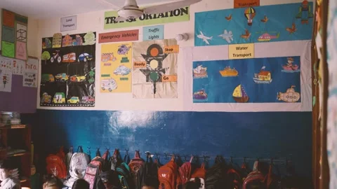 Classroom wall displays transportation learning posters—cars, boats, planes and Stock Footage 329224515