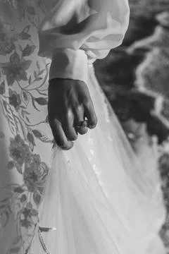 Classy Black &amp; White Close up of a Bride's wedding ring and dress Stock Photos