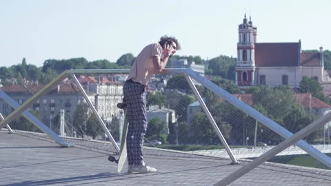 Classy dressed man calling on a phone while waiting for a meeting outdoor Stock Footage 132897876