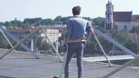 Classy dressed man calling on a phone while waiting for a meeting outdoor Stock Footage 132903176