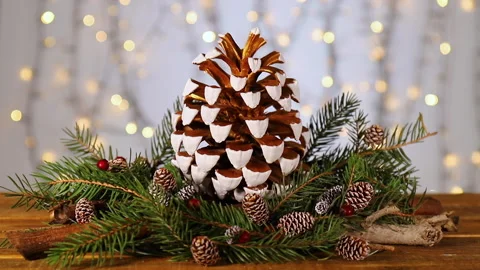Classy gilded pinecone centerpiece for a splash of holiday charm. Stock-Footage 143187870