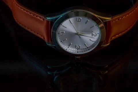 Classy Leather Watch Reflected on Black Table 库存照片