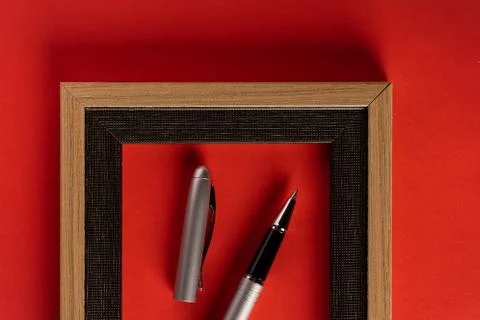 Classy silver pen and empty frame Stock Photos