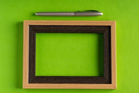 Classy silver pen and empty frame 写真素材