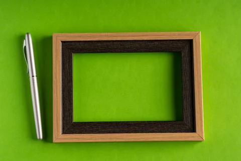 Classy silver pen and empty frame Stock Photos