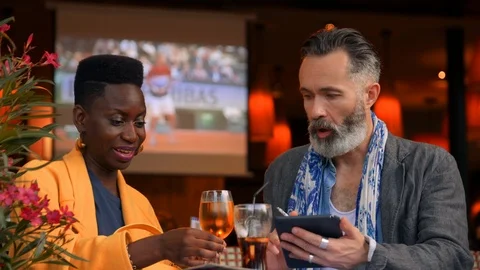 Classy Upper-Crust Couple Laughs Together Using a Touchscreen Computer Device. Stock Footage 120373003