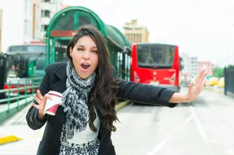 Classy woman wearing dark coat and black white clothing urban environment Stock-Fotos