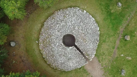 Clava Cairns Drone Dropping into Cairn 2000 BC near Inverness, Scotland 4K Stock Footage 145924334