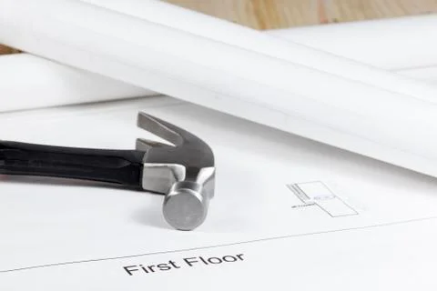 Claw hammer laying on a technical architectural drawing Stock Photos
