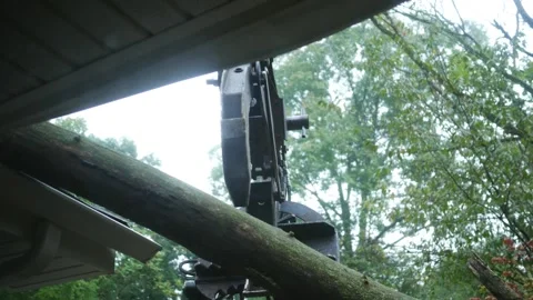 A Claw Machine Holding Tree Off Roof after Storm 2 库存影片 344826020