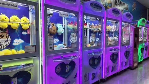 Claw machine shop with cute dolls at shopping mall Stock Footage 279894641