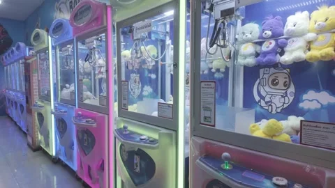 Claw machine shop with cute dolls at shopping mall Stock Footage 279894642