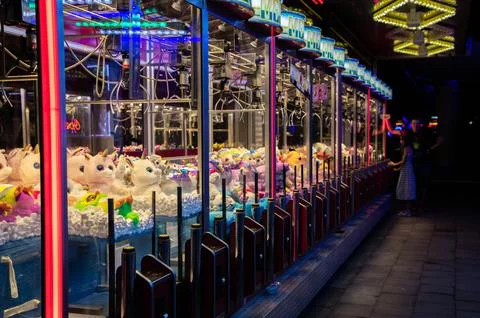 Claw machine Toy Arcade game filled with unicorns childrens toys Stock Photos