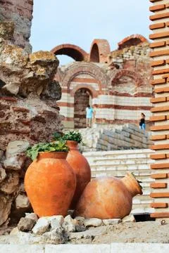 Clay amphora with plants Stock Photos