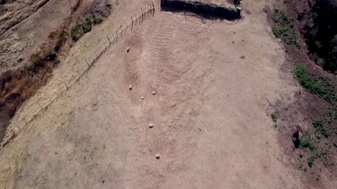 Clay authentic mountain House during sunset and horses, TILT aerial shot Stock Footage 89826147