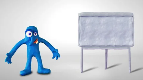 Clay Boy pointing to the side shows on the white marker board. Claymation. 動画素材 95963936