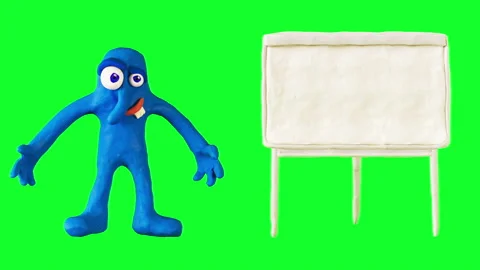Clay Boy pointing on the white marker board. Claymation. Greenscreen Stock Footage 95670823