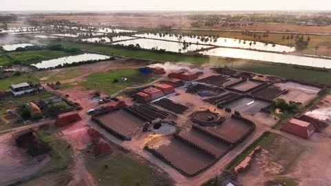 Clay bricks fired and stacked at a brick kiln Stock Footage 340607734
