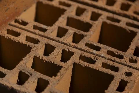 Clay bricks stack construction material close up Stock Photos