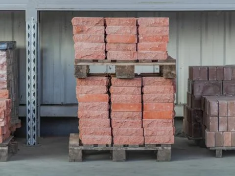 Clay bricks stock pallets stacking at the construction site. 写真素材
