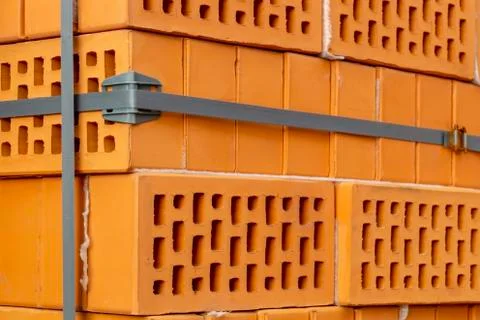 Clay bricks stock pallets stacking at the construction site. 写真素材