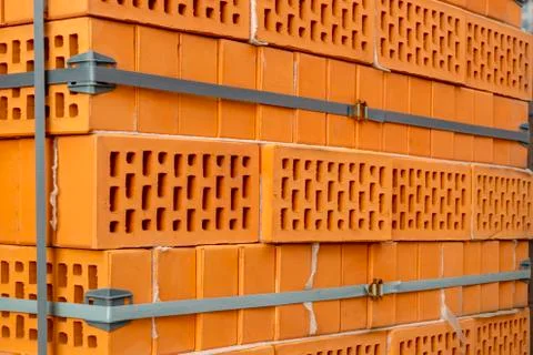 Clay bricks stock pallets stacking at the construction site. 写真素材