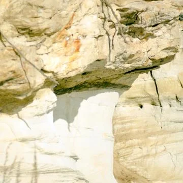 The clay cliff by the river with the beginning of occurrence of erosion types Fotos Stock