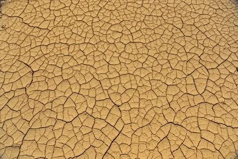 Clay cracks on the ground Stock Photos