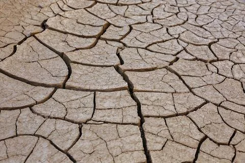 Clay cracks on the ground Stock Photos