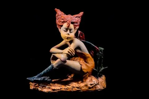 Clay elf statue isolated Stock Photos