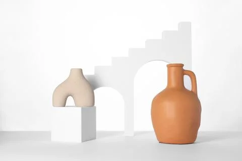 Clay flagon and decorative elements on white background Stockfoto's
