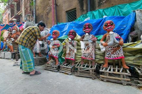 Clay idol of female demons being prepared Stock Photos