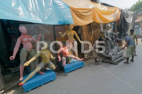 Clay idol of Goddess Kali being prepared Stock Photos