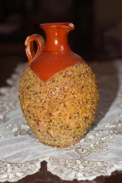 A clay jar over the table Stock Photos