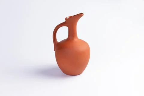 Clay jug. On a light background. Stock Photos