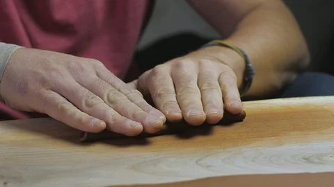 The clay master rolls the clay, then beats it with a wooden mallet. Handmade Stock Footage 120586589