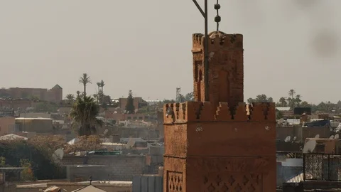 Clay minaret over rooftops of Marrakech. Morocco. Video stock 103857283