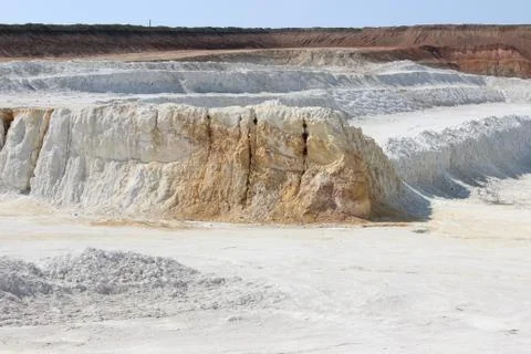 Clay mining. Beautiful background of white clay. Stock Photos