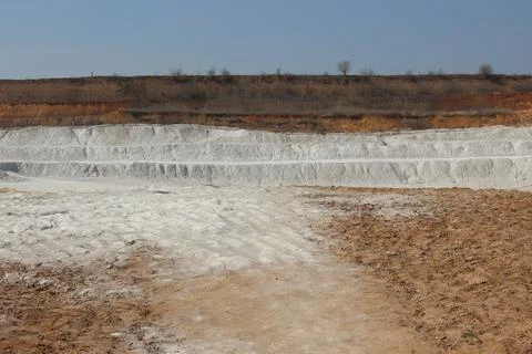 Clay mining. Beautiful background of white clay. Stock Photos